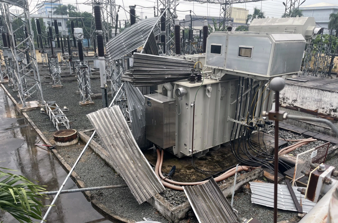 In southern Vietnam, firms experience power blackout after strong winds throw metal sheets on substation
