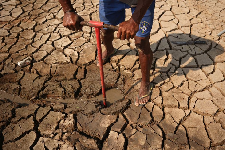 Amazon drought strands floating Brazilian village on lake turned into mud