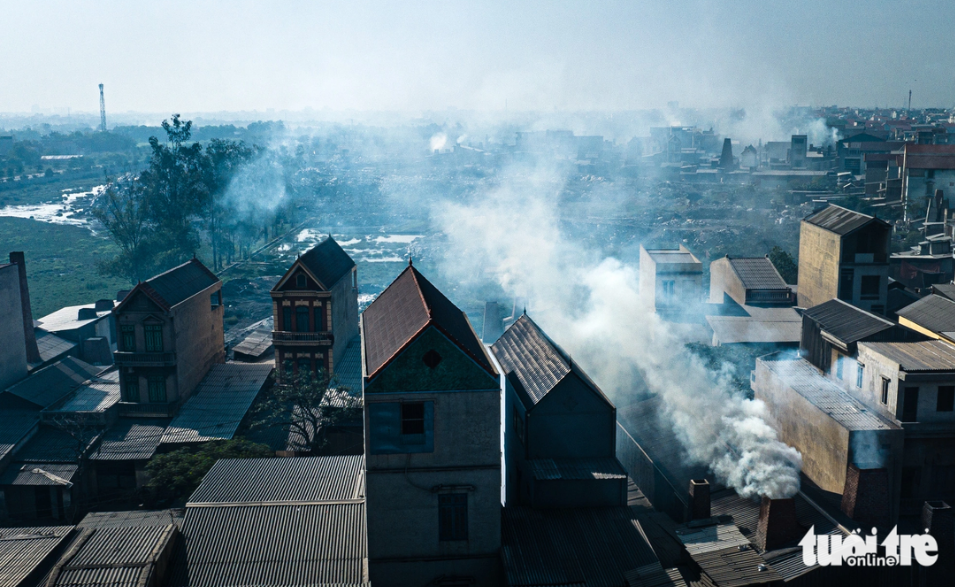 Dust, smoke blanket aluminum recycling village in northern Vietnam