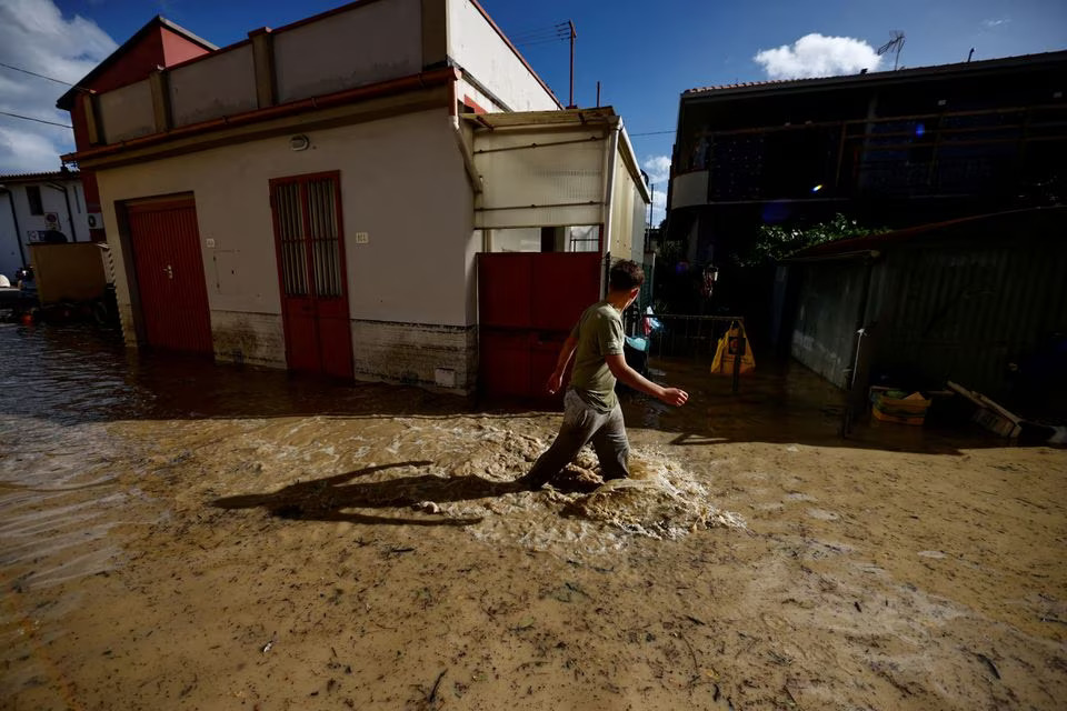 A man walks on a flooded street in the aftermath of Storm Ciaran, in Campi Bisenzio, in Tuscany region, Italy, November 3, 2023. Photo: Reuters