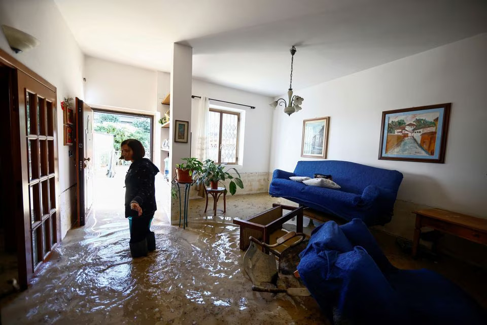 Enza Carfagno stands in her flooded apartment in the aftermath of Storm Ciaran, in Campi Bisenzio, in Tuscany region, Italy, November 3, 2023. Photo: Reuters