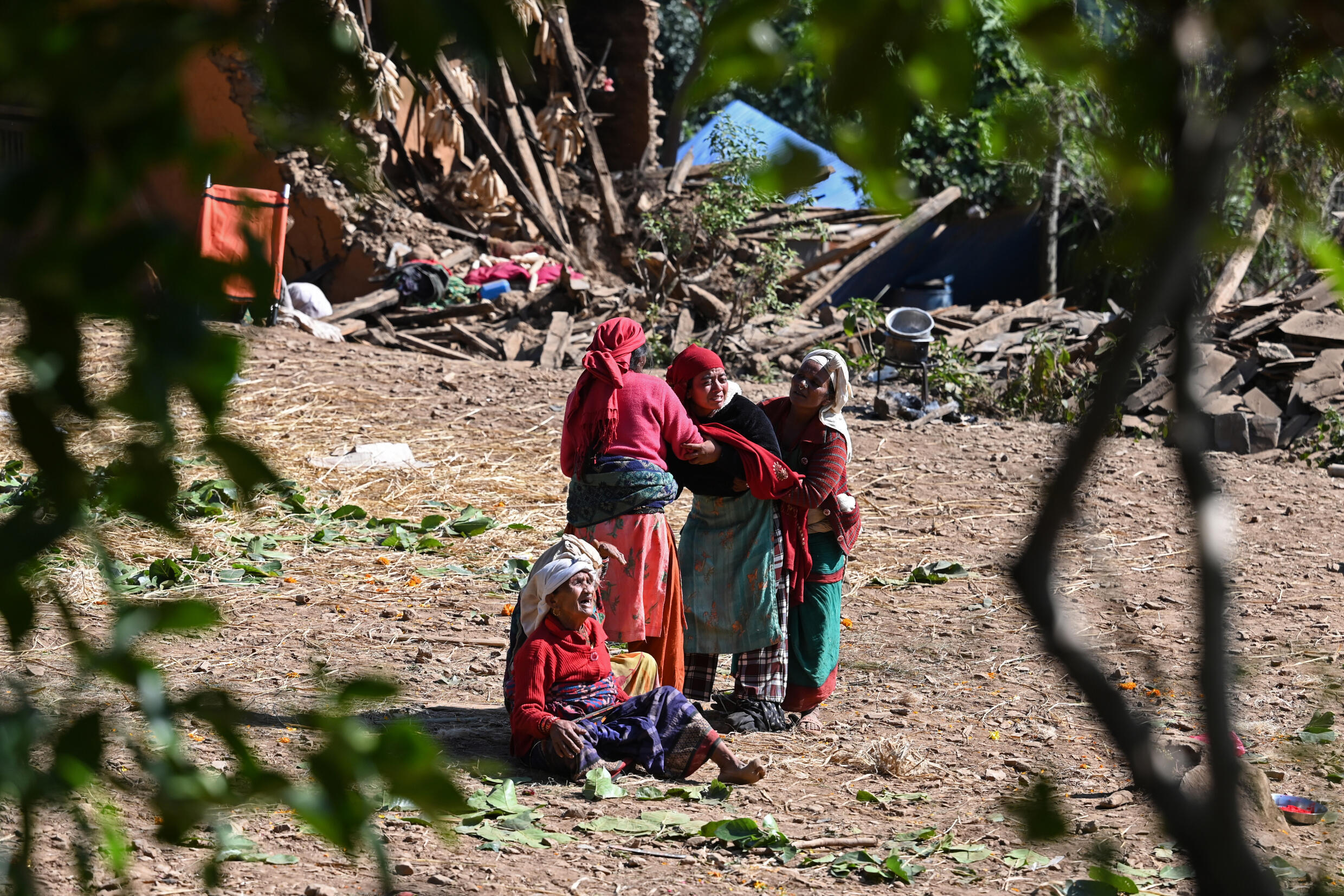 Family members of earthquake victims, mourn after their bodies were taken to a mass cremation ceremony in Chiuri village at Jajarkot district on November 5, 2023. Photo: AFP