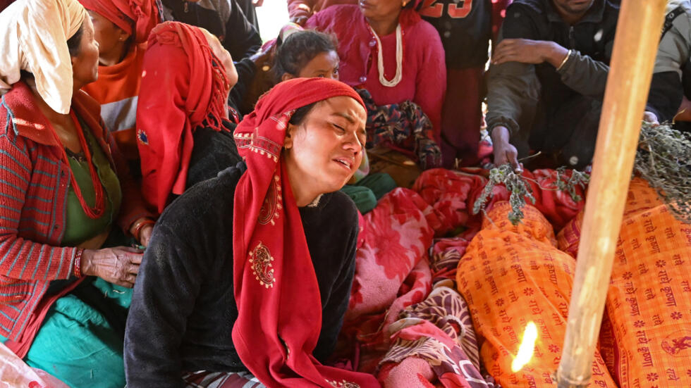 A woman mourns in Nepal's remote Chiuri village mourns the loss of her relative after a 5.6-magnitude quake killed at least 157 people. Photo: AFP