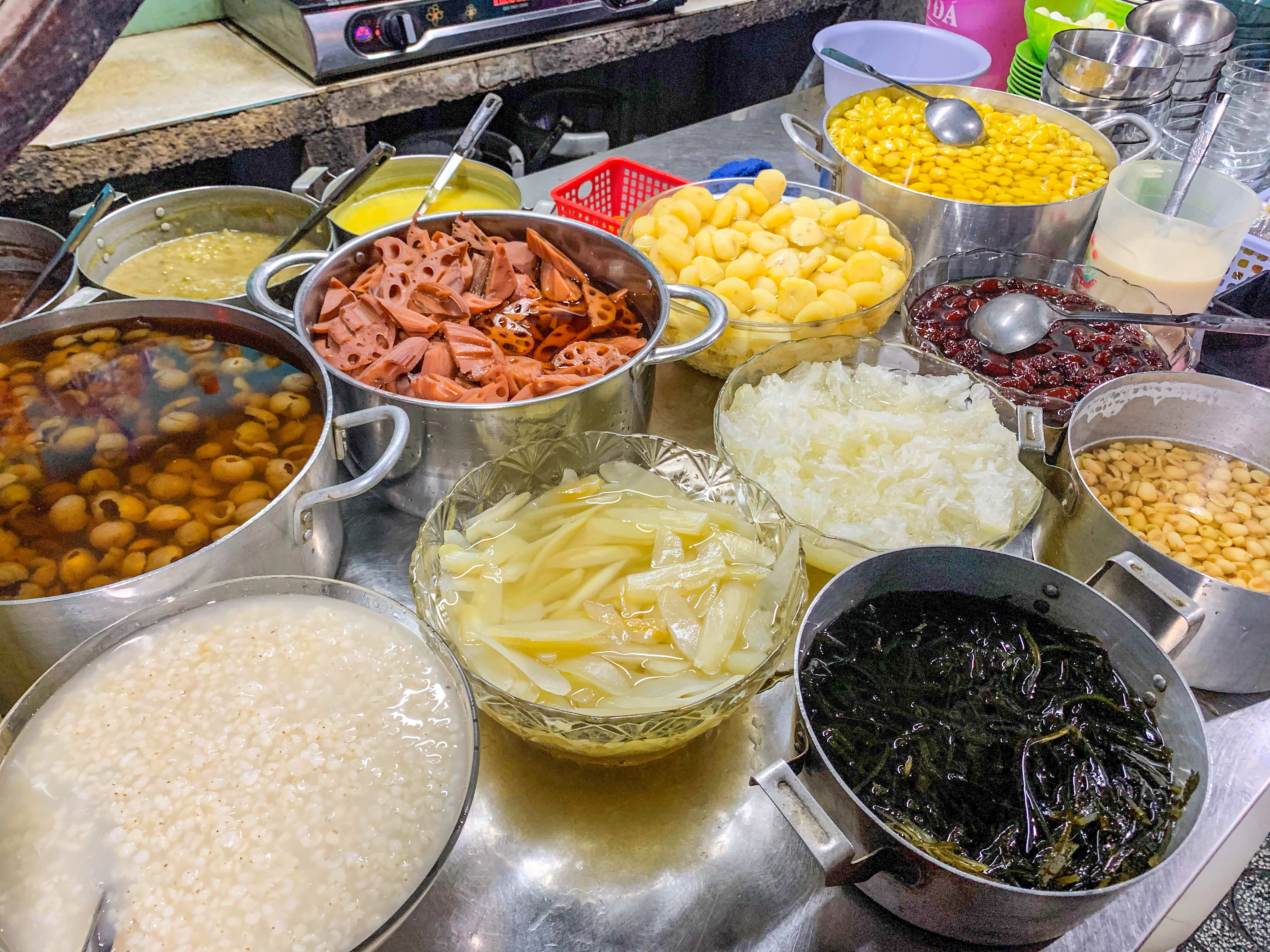 Homemade ingredients neatly organized at a sweet dessert stall in District 5, Ho Chi Minh City. Photo: Linh To / Tuoi Tre News
