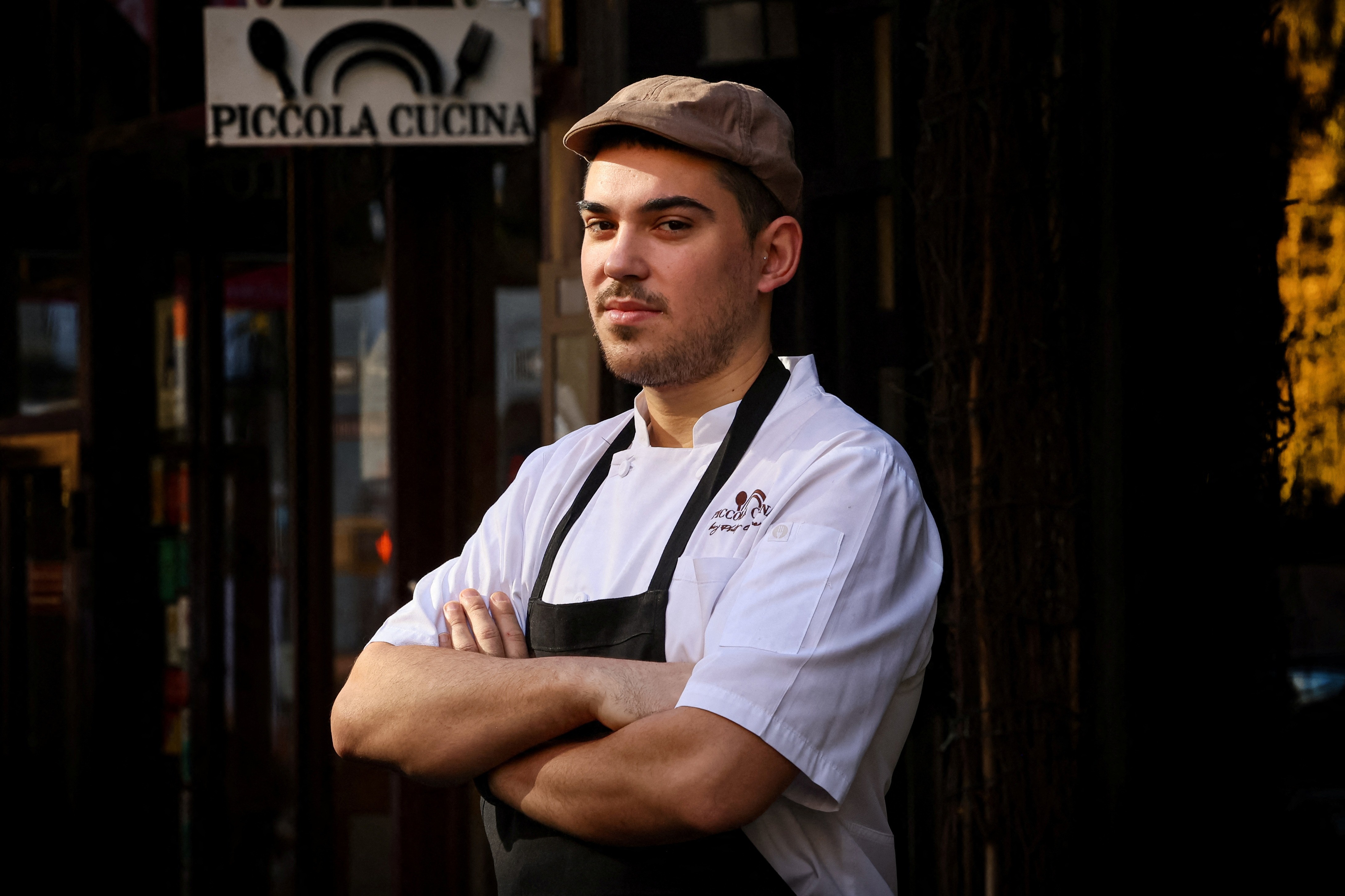 Chef Davide Sanna poses outside Piccola Cucina in the SoHo area of New York City, U.S., November 22, 2023. Photo: Reuters