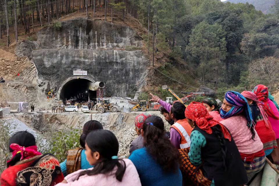 People wait outside a tunnel where rescue operations are underway to rescue trapped workers, after the tunnel collapsed, in Uttarkashi in the northern state of Uttarakhand, India. Photo: Reuters