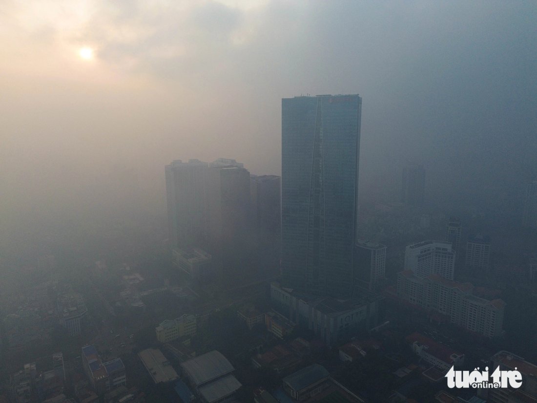 Hanoi’s second highest building is still engulfed in the thick smog although the sun is up.