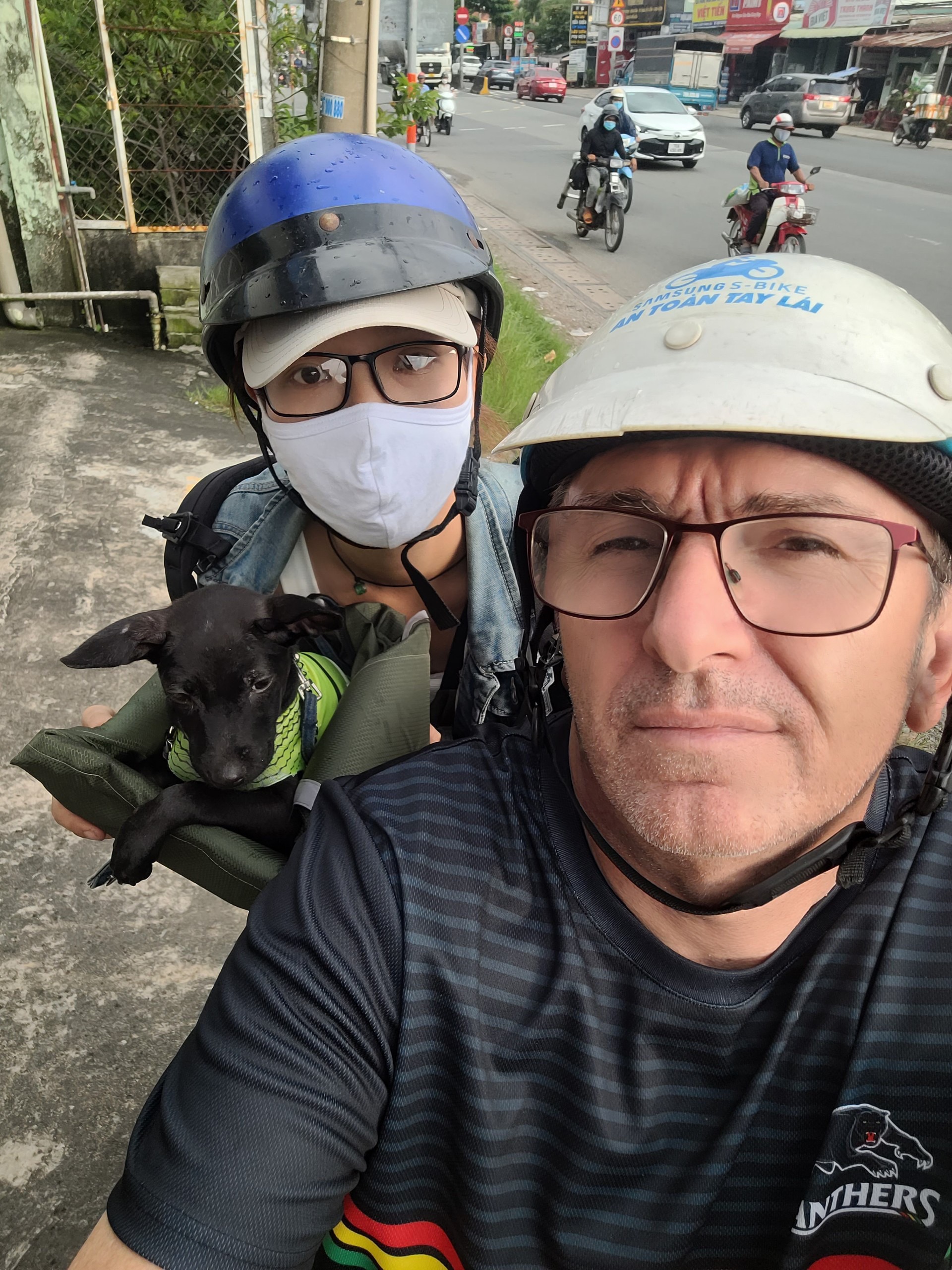 In this supplied photo, Ray Kuschert and his wife are taking the couple's pet dog to a resort in Cu Chi District, Ho Chi Minh City.
