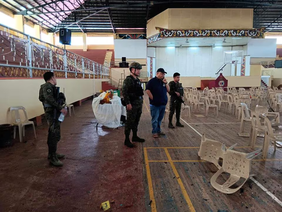 Lanao Del Sur Governor Mamintal Adiong Jr. looks on as law enforcement officers investigate the scene of an explosion that occurred during a Catholic Mass in a gymnasium at Mindanao State University in Marawi, Philippines, December 3, 2023. Photo: Reuters