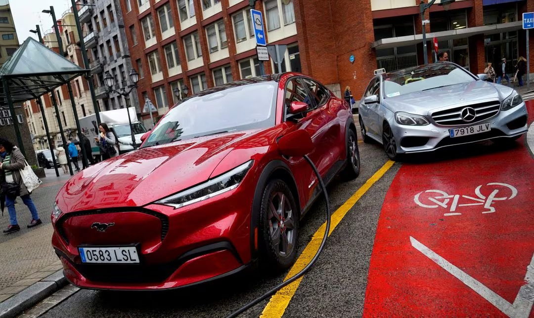 <em>A Ford Mustang Mach-e electric vehicle is seen plugged into a charging station in Bilbao, northern Spain, November 10, 2023. Photo:</em> Reuters