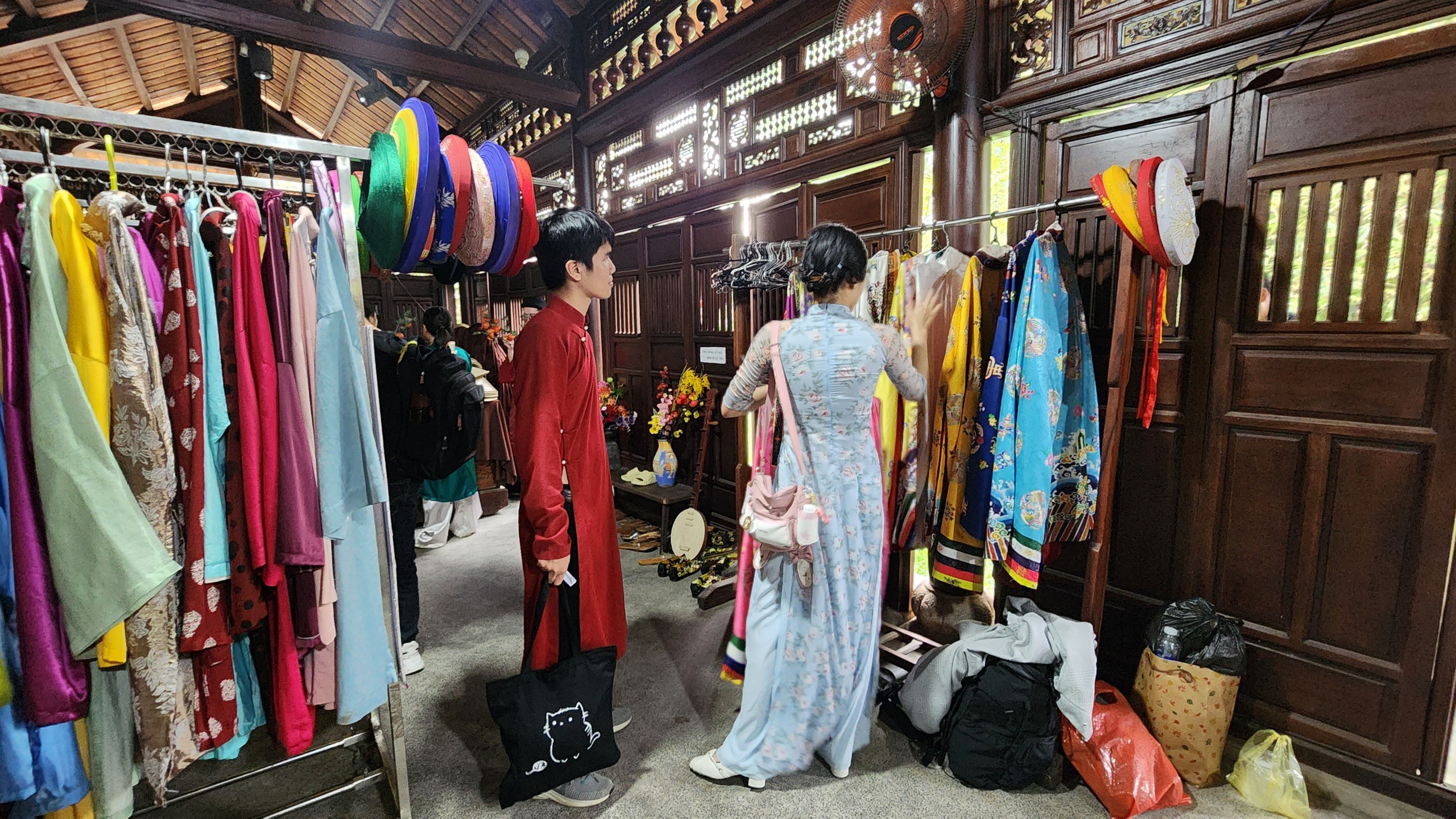 Tourists choose ao dai to rent for photoshoots while visiting the Ao Dai Museum in Thu Duc City, Ho Chi Minh City.  Photo: Minh Chau / Tuoi Tre News