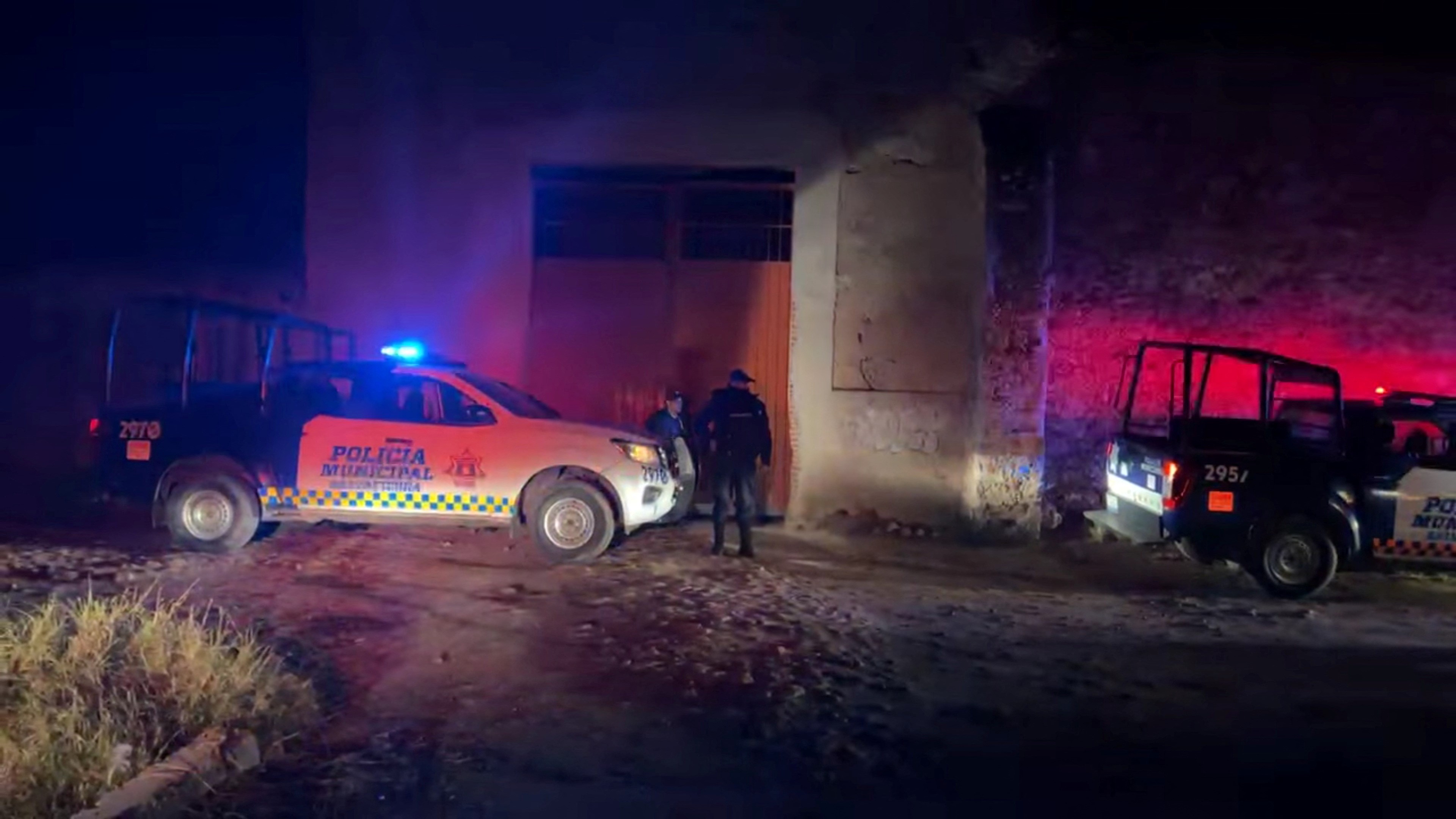 Police officers and vehicles are positioned outside the site of a party where, according to local media, an armed group opened fire on partygoers attending a posada, a traditional Mexican party held in the days leading up to Christmas, in Salvatierra, Guanajuato state, Mexico December 17, 2023, in this screen grab obtained from social media video. Photo: Reuters