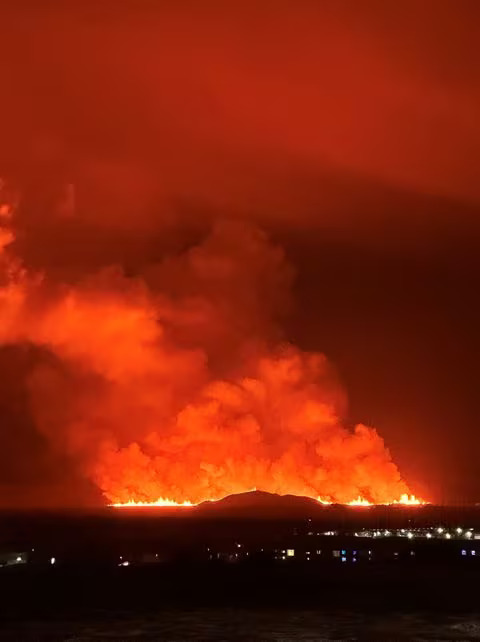 A volcano spews lava and smoke as it erupts, in this view from Keflavik, Iceland December 18, 2023 in this picture obtained from social media. Photo: Reuters