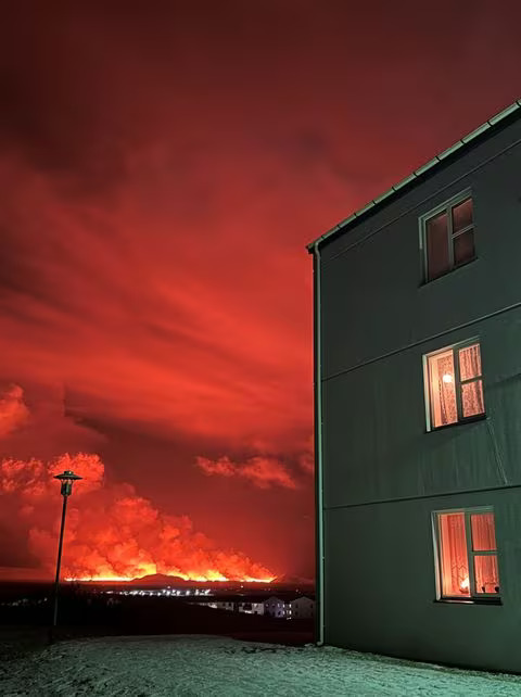 A volcano spews lava and smoke as it erupts, in this view from Keflavik, Iceland December 18, 2023 in this picture obtained from social media. Photo: Reuters