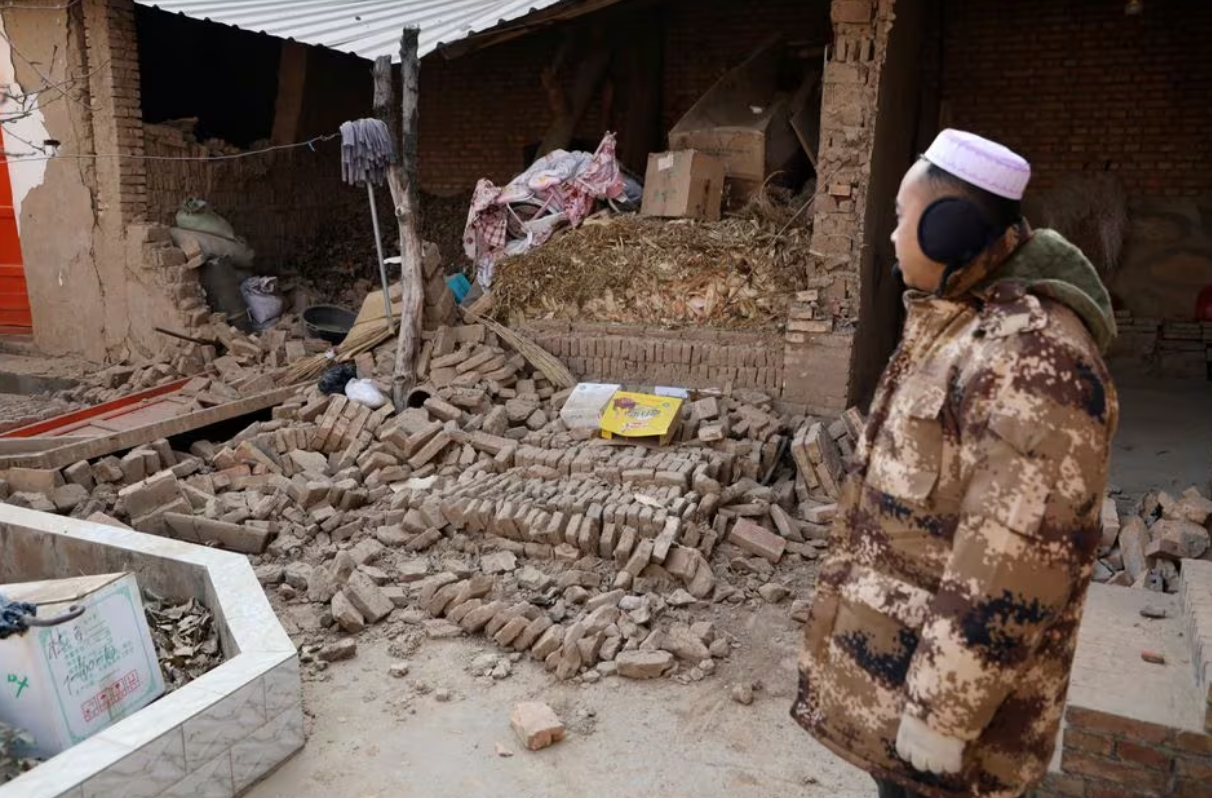 A man stands at his damaged house at Sibuzi village following the earthquake in Jishishan county, Gansu province, China December 21, 2023. Photo: Reuters