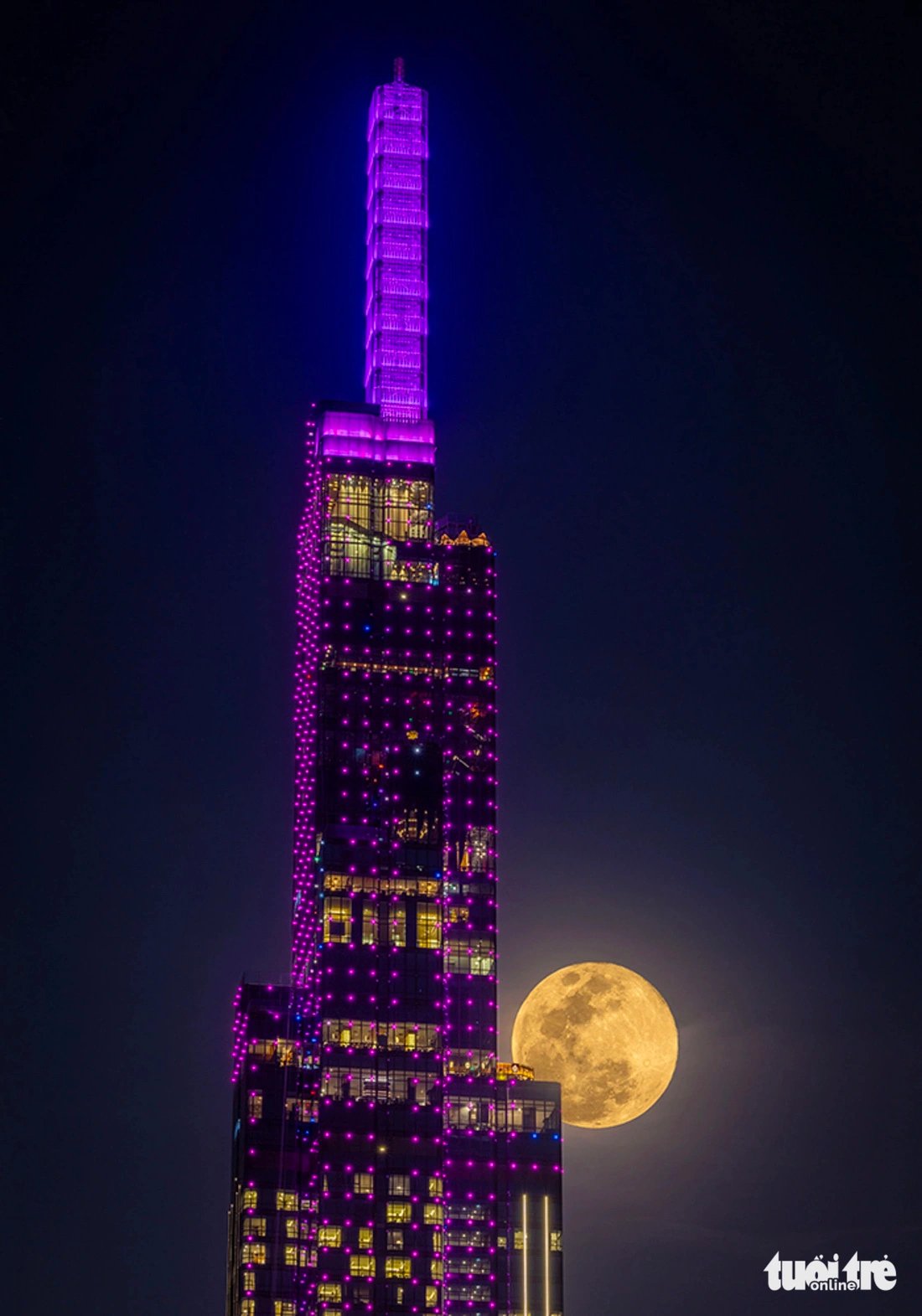 Landmark 81, Vietnam's tallest building, on the background of the full moon is seen in this photo taken in December 2023, using overlay and high dynamic range (HDR) techniques. Photo: Minh Hoa / Tuoi Tre