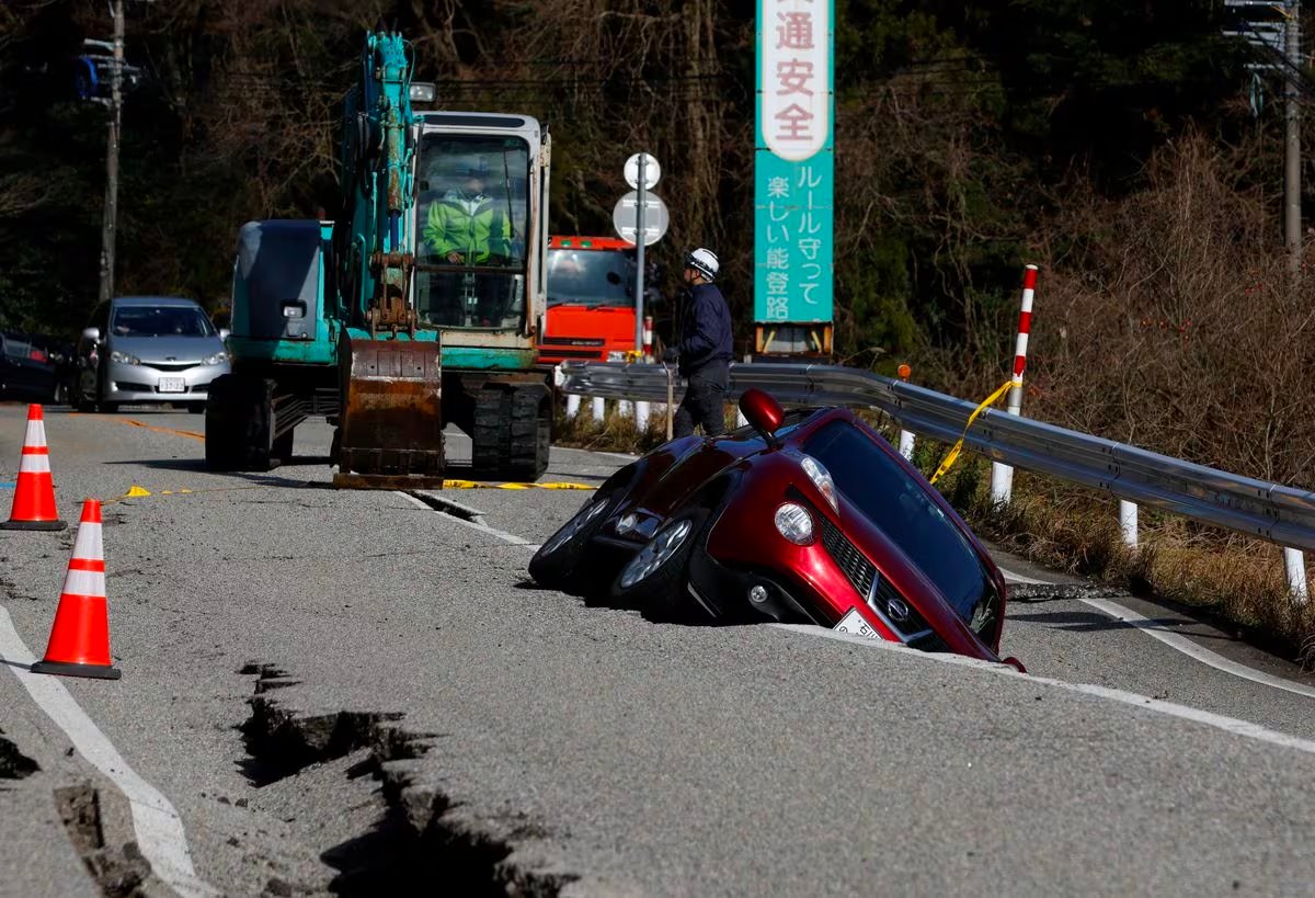 A view of a car stuck in a crack in the road, following an earthquake, near Ujima, Ishikawa prefecture, Japan January 2, 2024. Photo: Reuters