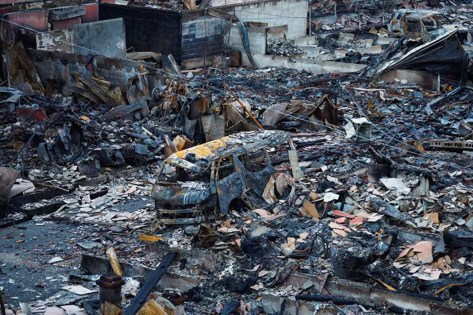 Debris accumulates along Asaichi-dori street, which burned down due to a fire following an earthquake, in Wajima, Japan, January 4, 2024. Photo: Reuters