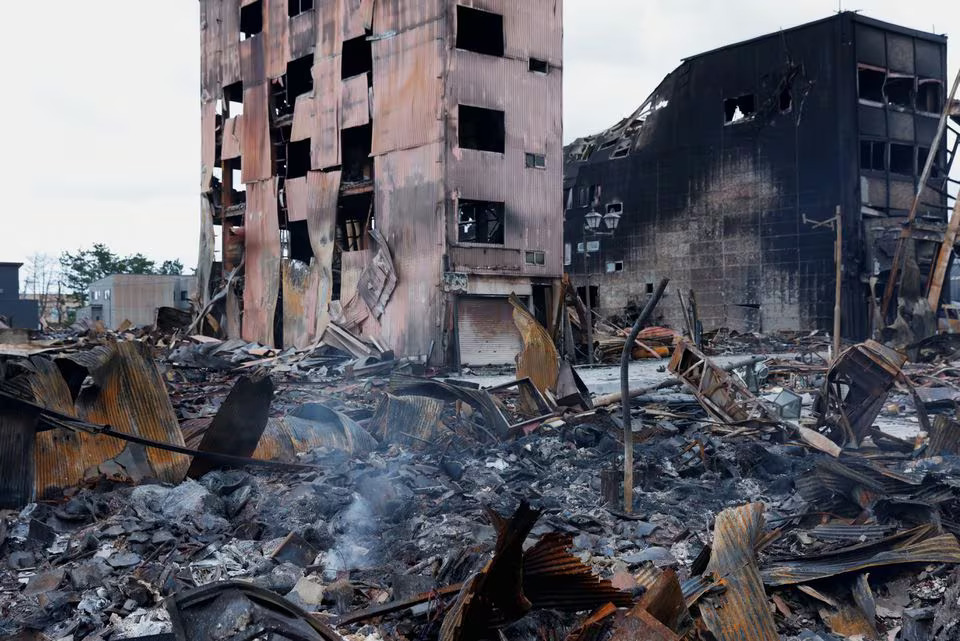 Burnt buildings are among the debris along Asaichi-dori street, which burned down due to a fire following an earthquake, in Wajima, Japan, January 4, 2024. Photo: Reuters