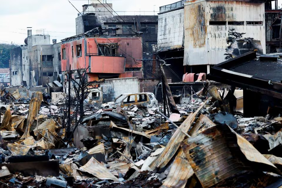 Debris accumulates along Asaichi-dori street, which burned down due to a fire following an earthquake, in Wajima, Japan, January 4, 2024. Photo: Reuters