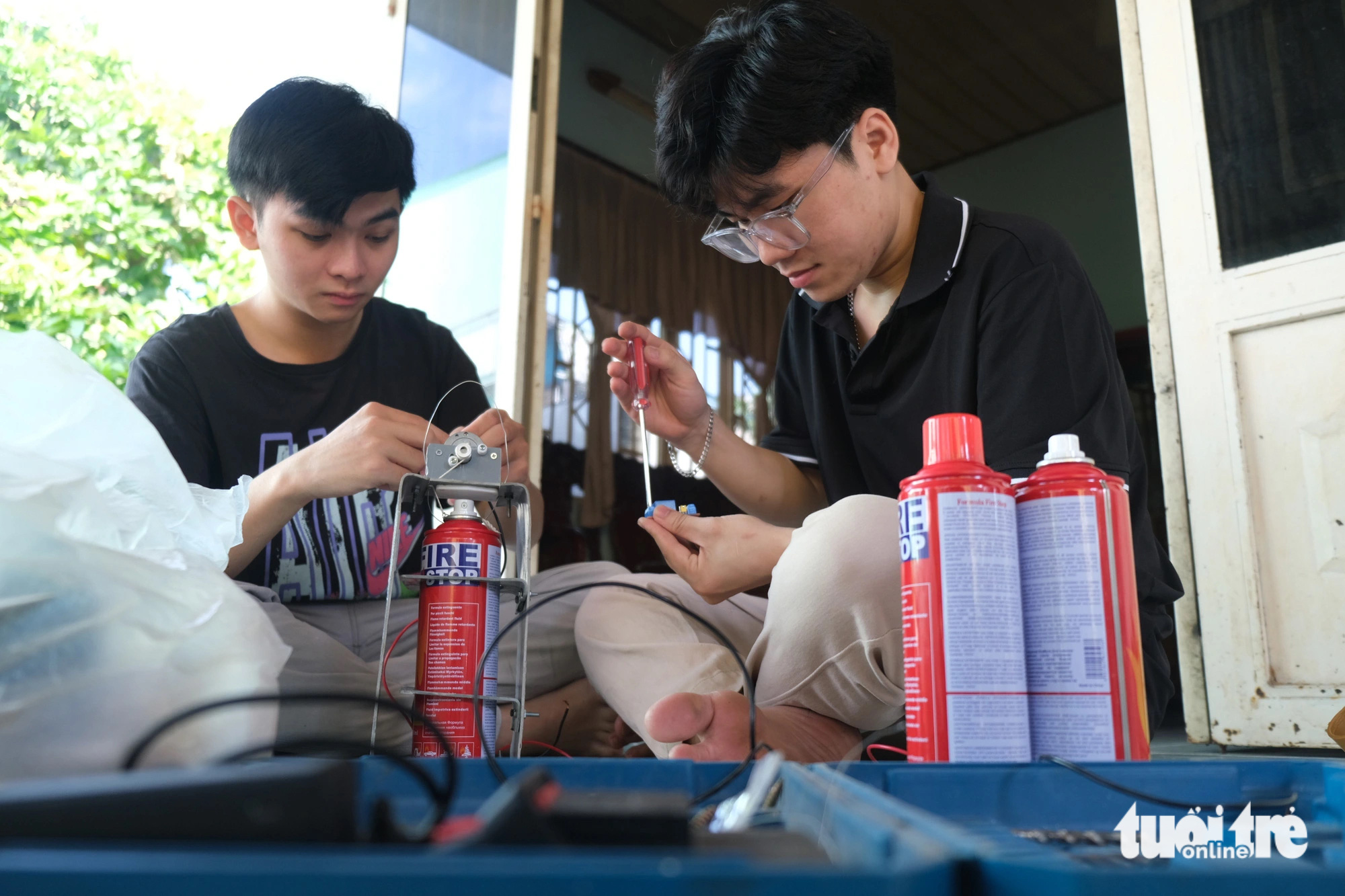 Two students from the Ho Chi Minh City University of Technology and Education develop a short-circuit and explosion prevention system for motorcycles. Photo: Ngoc Phuong / Tuoi Tre