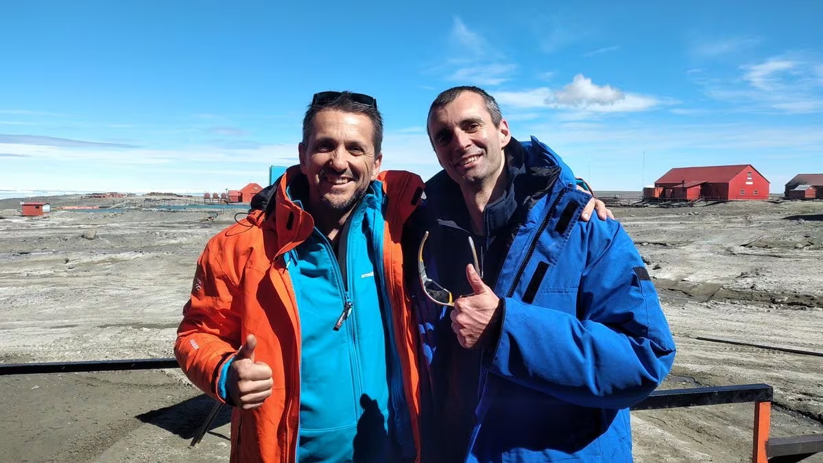 Researcher at the Argentine Antarctic Institute (IAA) Lucas Ruberto and laboratory technician at the International Atomic Energy Agency (IAEA) Francois Oberhansli pose for a picture at Base Marambio, Antarctica, January 6, 2024. Photo: Reuters