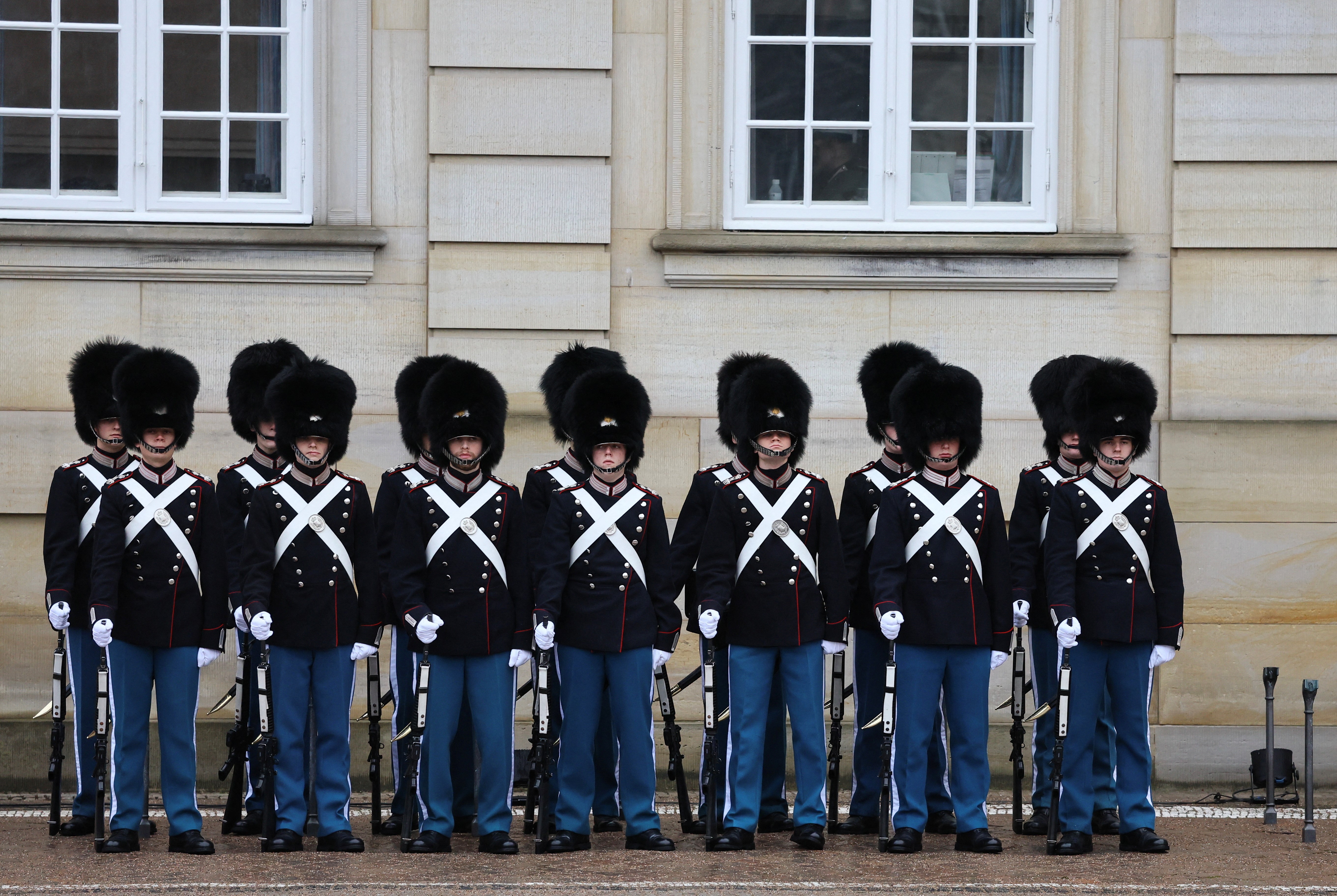 The Danish Royal Guard stands in front of Amalienborg Palace during the daily exchange of the guards routine in Copenhagen, Denmark, January 13, 2024. Photo: Reuters