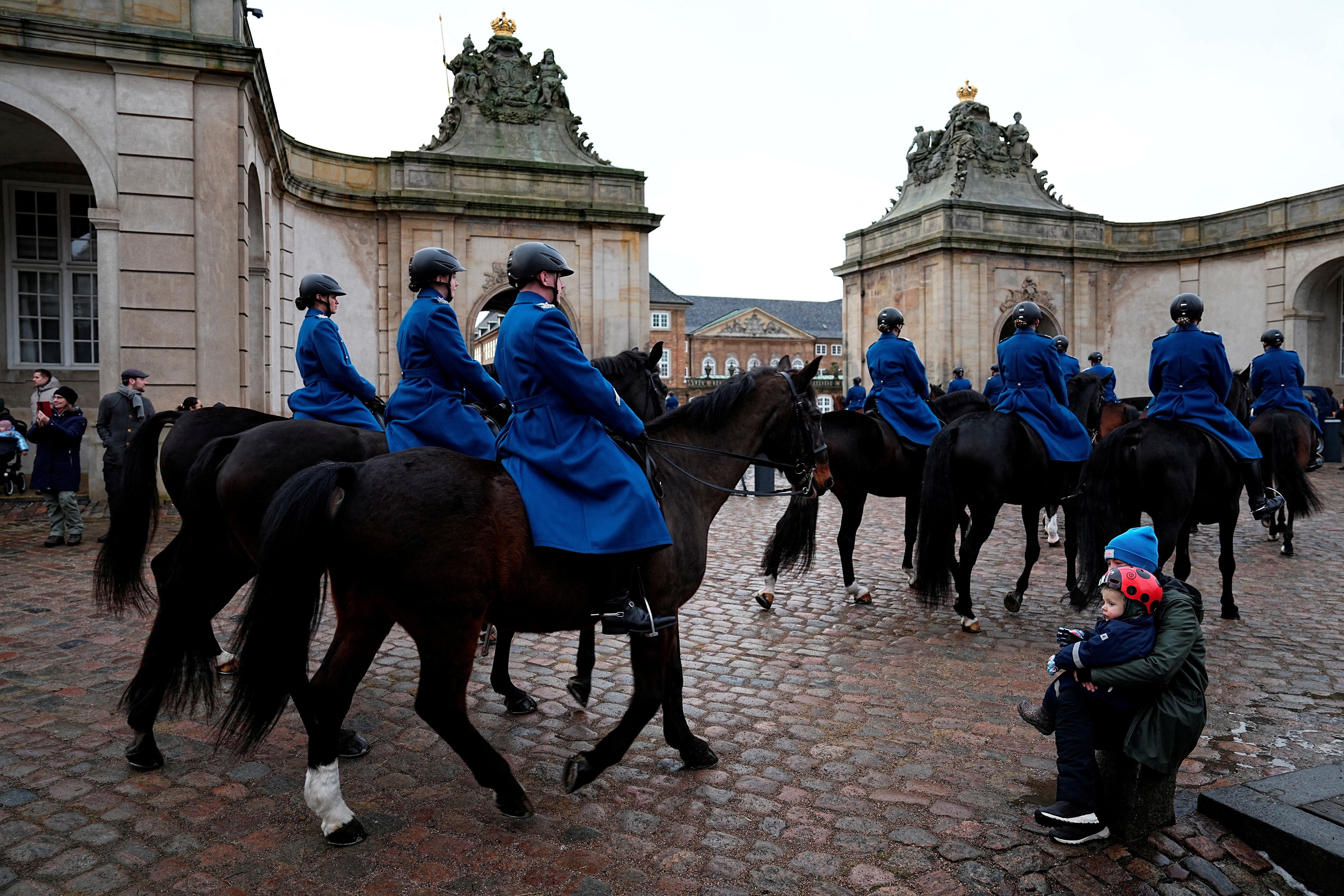 Soldiers from the Danish Guard Hussar regiment ride outside the Royal Stables at Christiansborg Palace as they rehearse for Sunday, January 14, when Denmark's Queen Margrethe is to abdicate and her eldest son, Crown Prince Frederik, is to take the throne, in Copenhagen, Denmark, January 13, 2024. Photo: Reuters