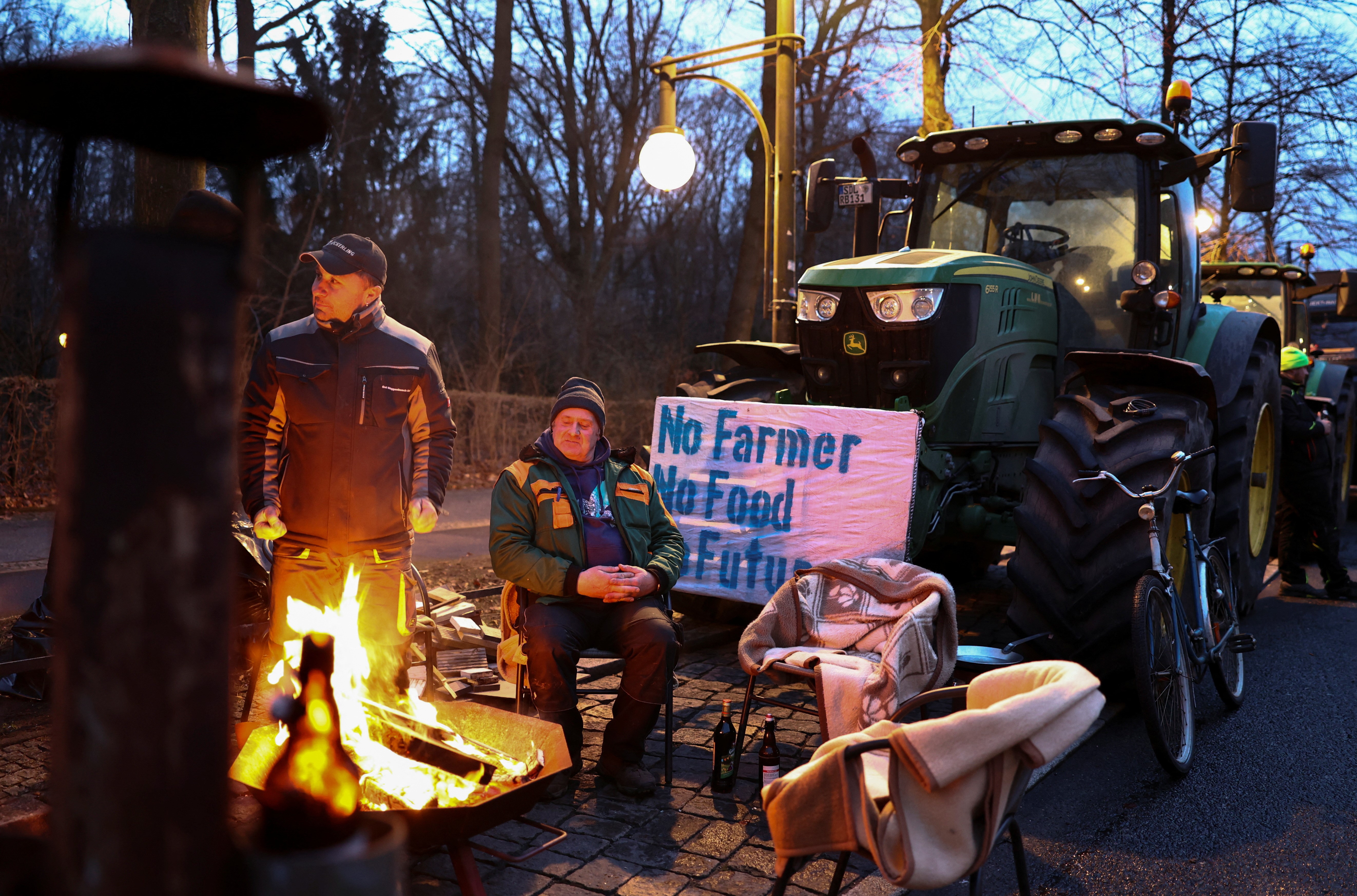 Farmers prepare one day before a large protest against the cut of farm vehicle tax subsidies of the so-called German Ampel coalition government, in Berlin, Germany, January 14, 2024. Photo: Reuters