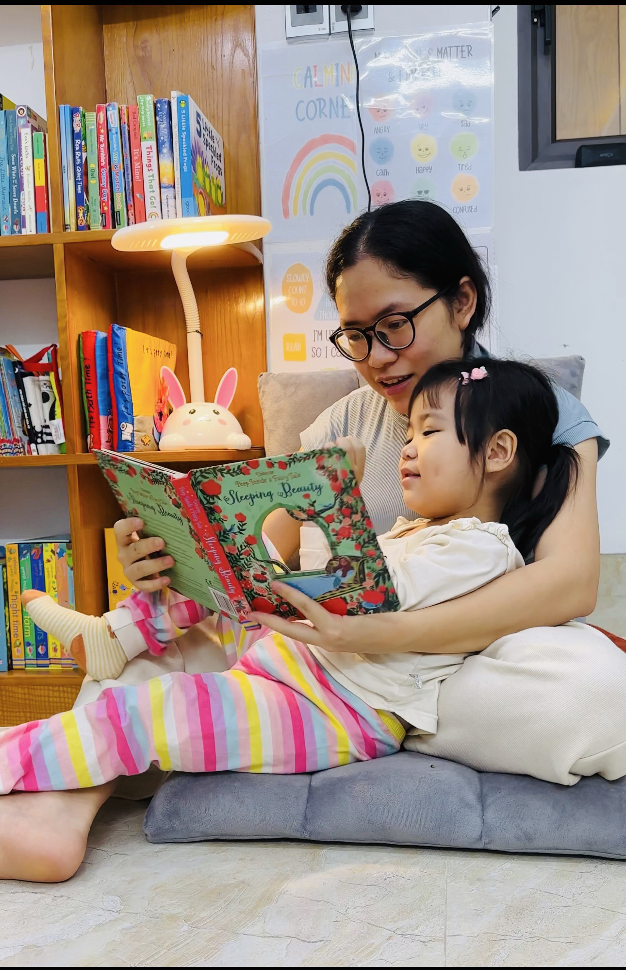 Le Thi Thuy Phuong reads a book with her daughter in Ha Giang Province, northern Vietnam. Photo: Supplied