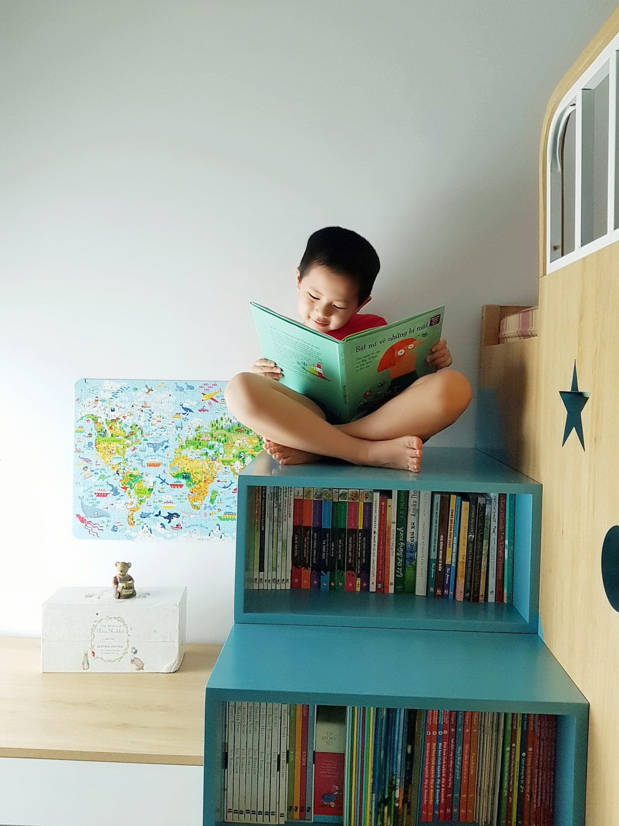 Pham Thi Hoai Anh’s son enjoys a book at a reading corner in their house in Hanoi. Photo: Supplied