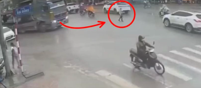 CCTV footage captures a traffic accident involving a truck and a pedestrian in My Duc District, Hanoi, January 2024. Supplied