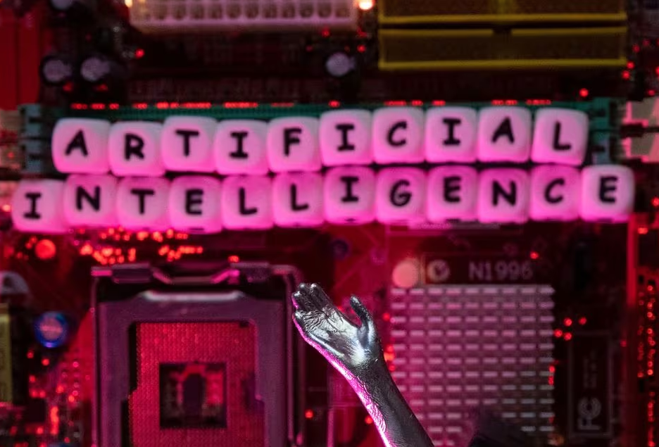 AI (Artificial Intelligence) letters and robot hand are placed on computer motherboard in this illustration taken, June 23, 2023. Photo: Reuters