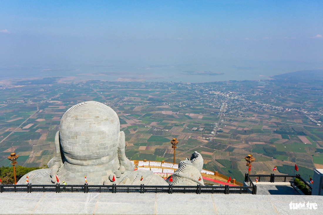 A vast scene of part of southern Vietnam’s Tay Ninh Province is seen from the front of the Maitreya Buddha on the peak of Ba Den Mountain. Photo: Chau Tuan / Tuoi Tre