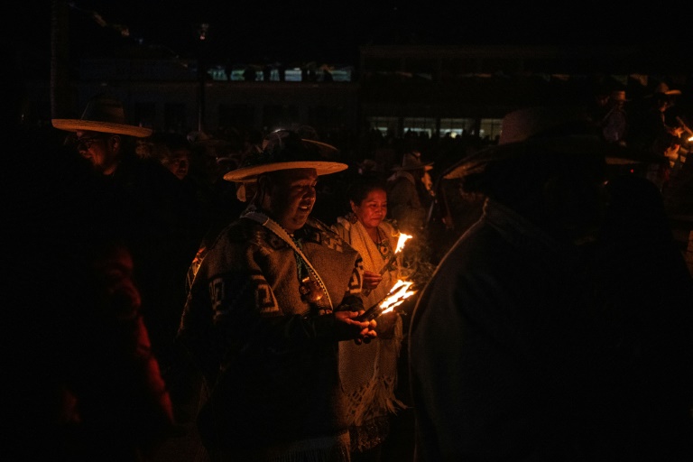 Members of Mexico's Purepecha community light wooden sticks during an ancient fire ceremony. Photo: AFP