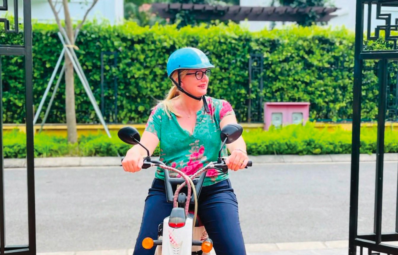 In this photo, Swedish Ambassador to Vietnam Ann Mawe is seen riding a scooter.