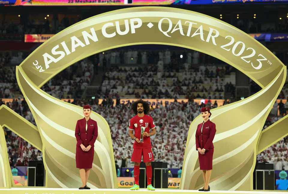 Soccer Football - AFC Asian Cup - Final - Jordan v Qatar - Lusail Stadium, Lusail, Qatar - February 10, 2024 Qatar's Akram Afif celebrates with the trophy for player of the tournament. Photo: Reuters