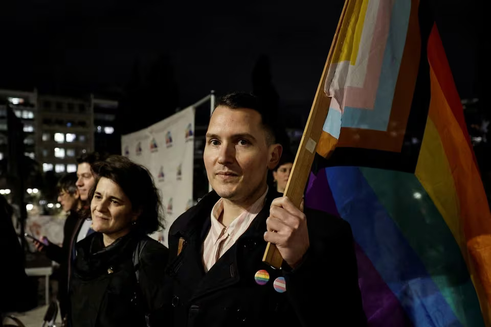 LGBTQ+ activists and supporters gather in front of the Greek parliament, ahead of the vote on the bill which legalises same-sex civil marriage, in Athens, Greece, February 15, 2024. Photo: Reuters