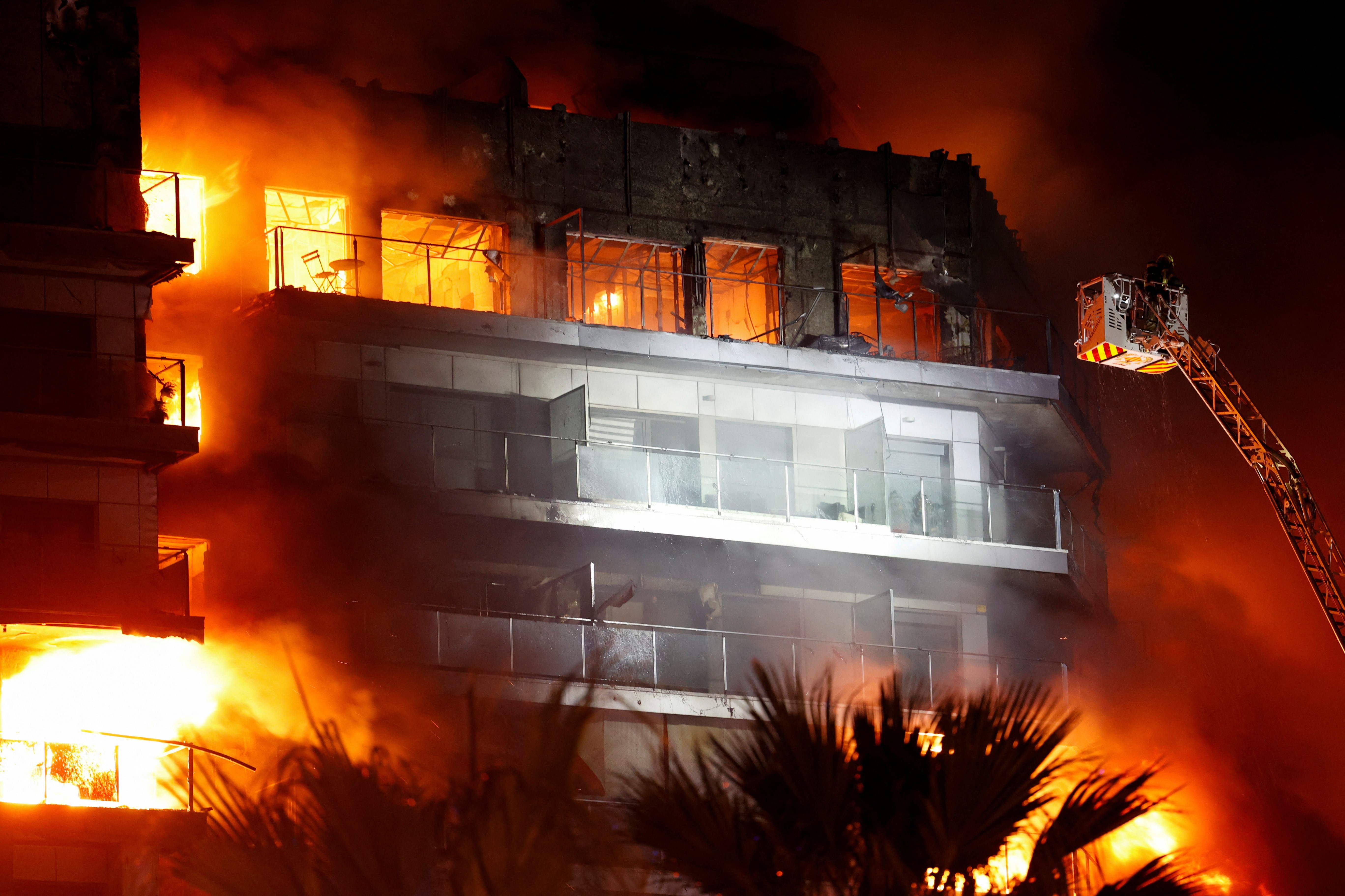 Firefighters work at the scene of a fire of apartment building in Valencia, Spain February 22, 2024. Photo: Reuters