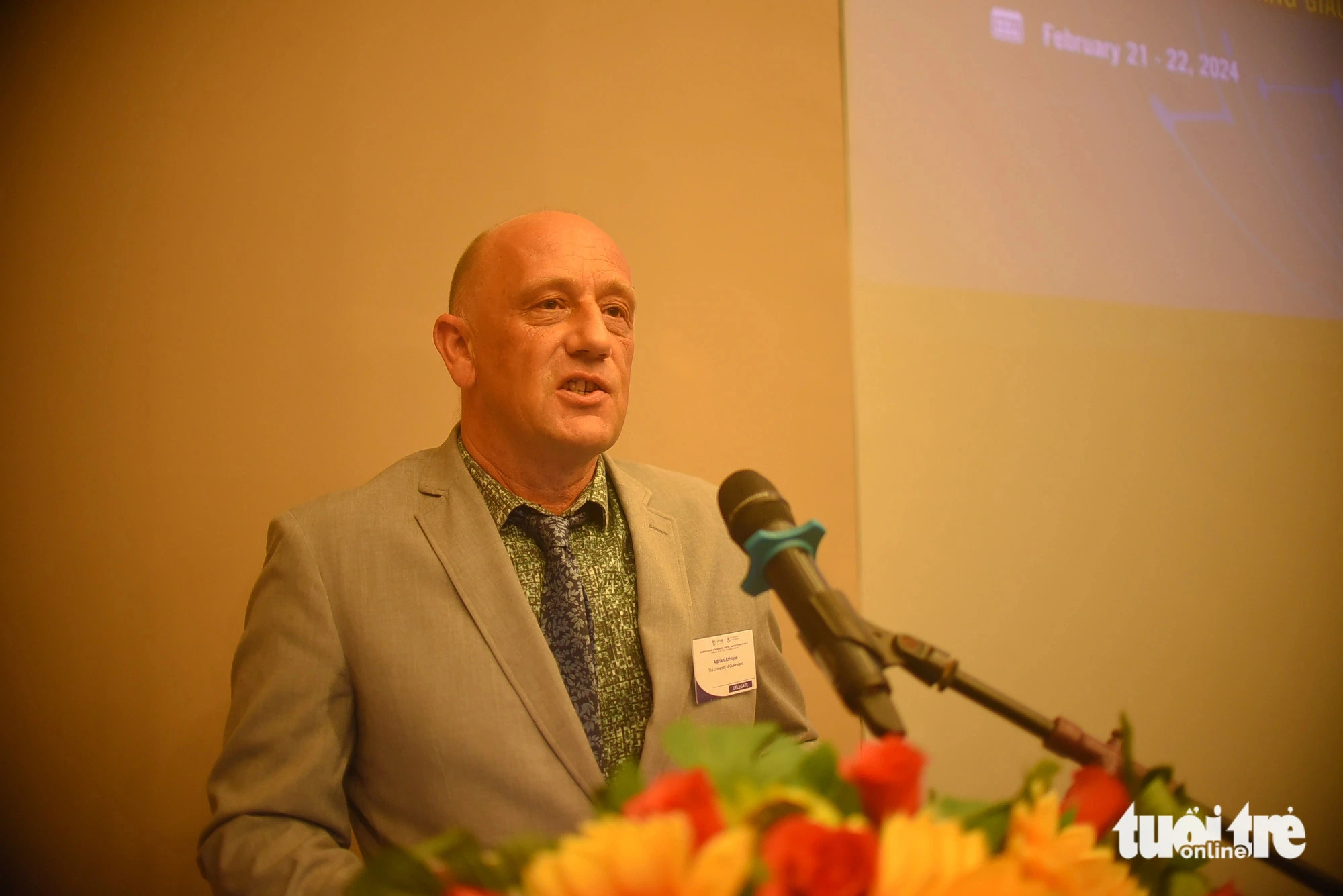 Associate Professor Adrian Athique from the University of Queensland in Austria delivers a speech at the scientific event, February 21, 2024. Photo: Lam Thien / Tuoi Tre