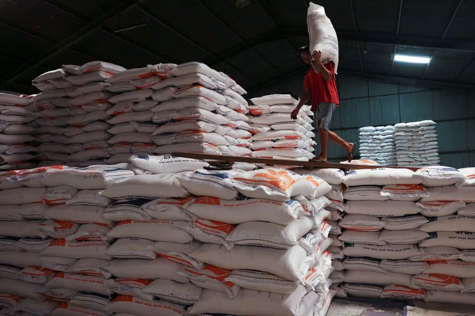 Sprawling queues for subsidised rice highlight plight of Indonesia's poor