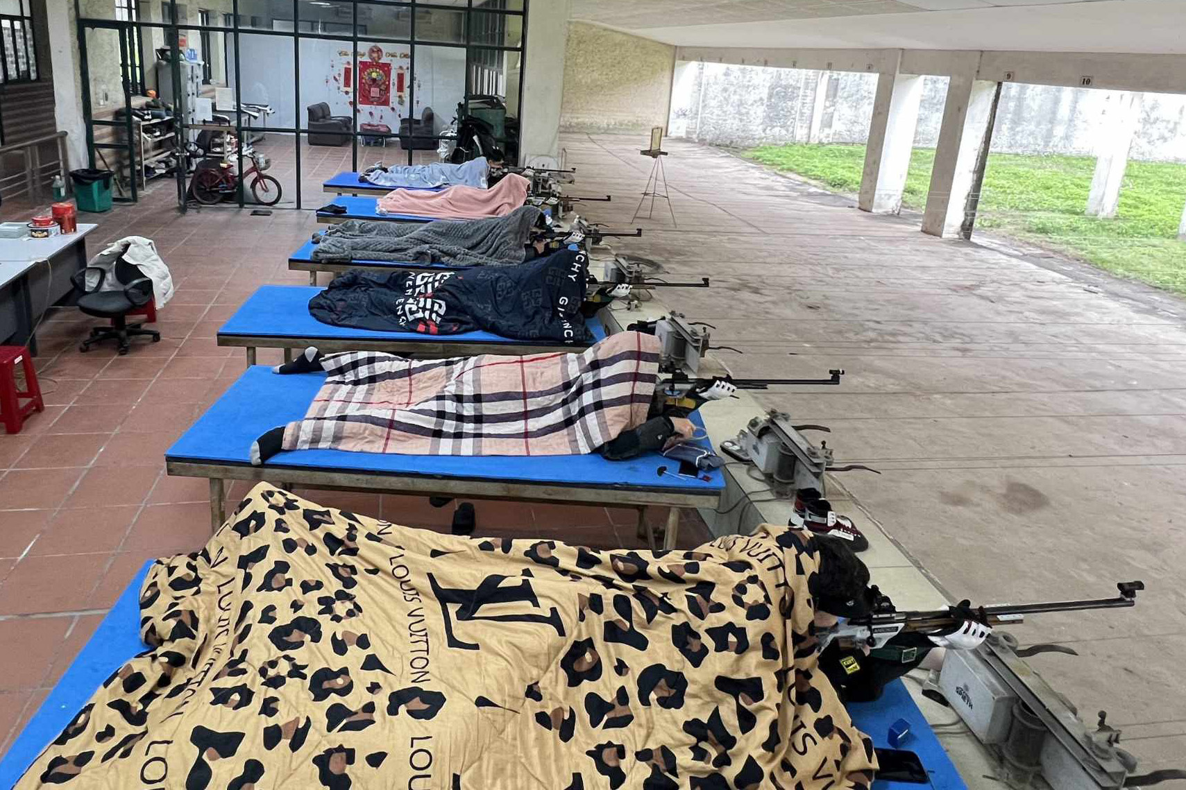 Shooters bundle up in blankets amid frigid weather in northern Vietnam