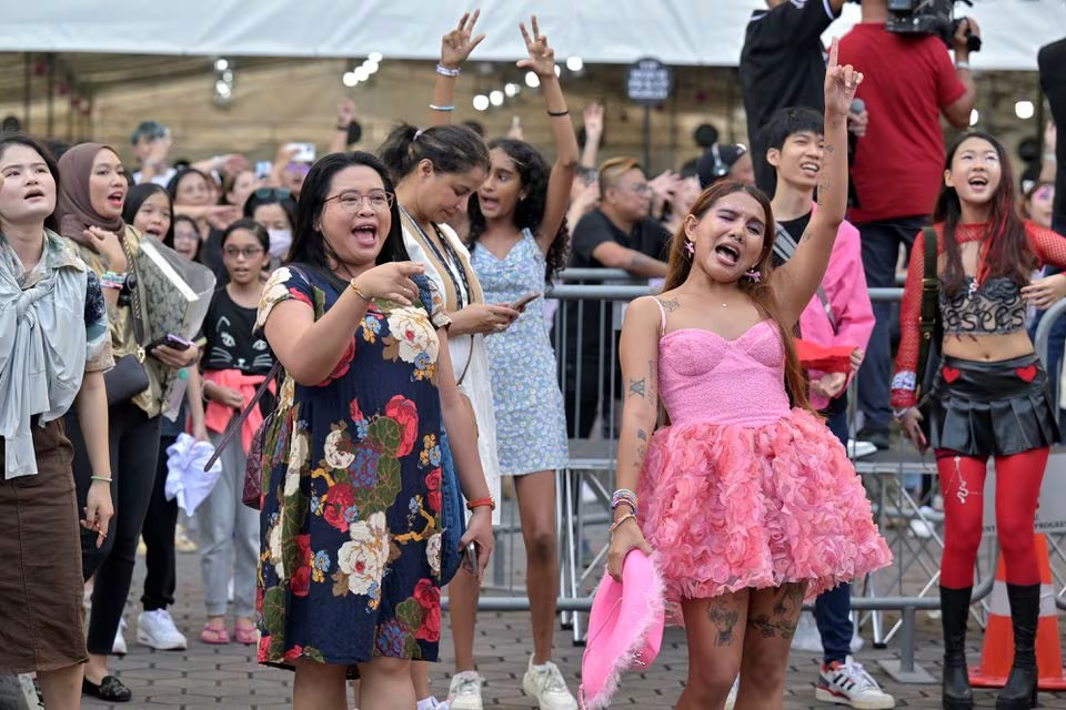 Taylor Swift's fans, or Swifties, sing and dance to her music at the National Stadium for Swift's Eras Tour concert in Singapore March 2, 2024. Photo: Reuters