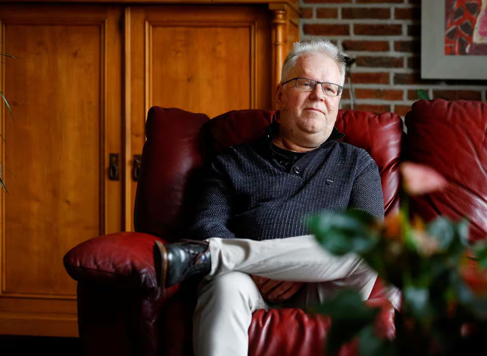 Bert Janssen, 57 years old, sits on a sofa in his house in Herkenbosch, Netherlands February 29, 2024. He underwent a heart transplant at the age of 17, almost 40 years ago, receiving a donor heart which is now immortalized in the Guinness Book of Records. Photo: Reuters