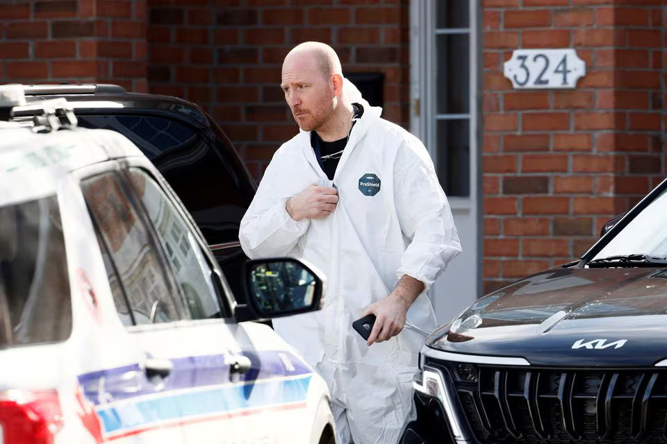 An emergency responder leaves the home where four children and two adults were found dead inside in the Ottawa suburb of Barrhaven, Ontario, Canada March 7, 2024. Photo: Reuters