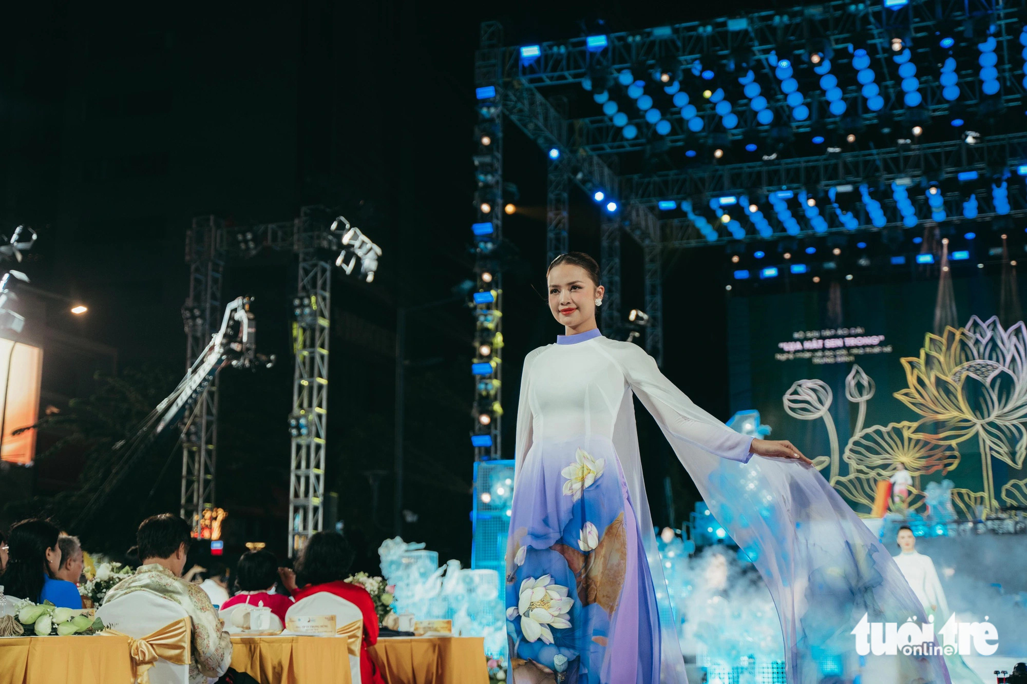 Miss Universe Vietnam 2022 Nguyen Thi Ngoc Chau showcases a new ‘ao dai’ design during the opening night of the 2024 Ho Chi Minh City Ao Dai Festival, March 7, 2024. Photo: Thanh Hiep / Tuoi Tre