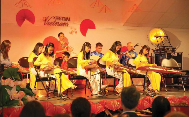 The Phuong Ca Rennes club performs at an event displaying Vietnamese 'ao dai' in Lorient, France. Photo: Supplied