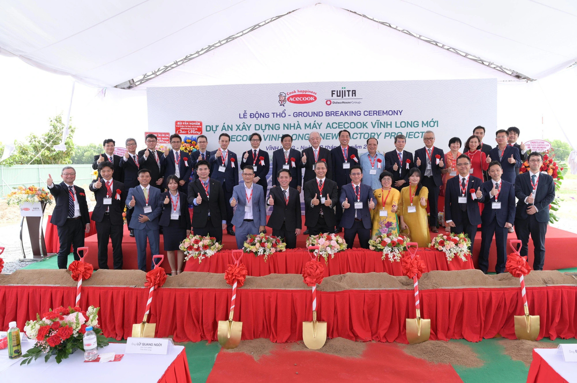 Delegates pose for a group photo at a ground-breaking ceremony of the Acecook factory project in Vinh Long Province, southern Vietnam, March 8, 2024. Photo: D.H / Tuoi Tre