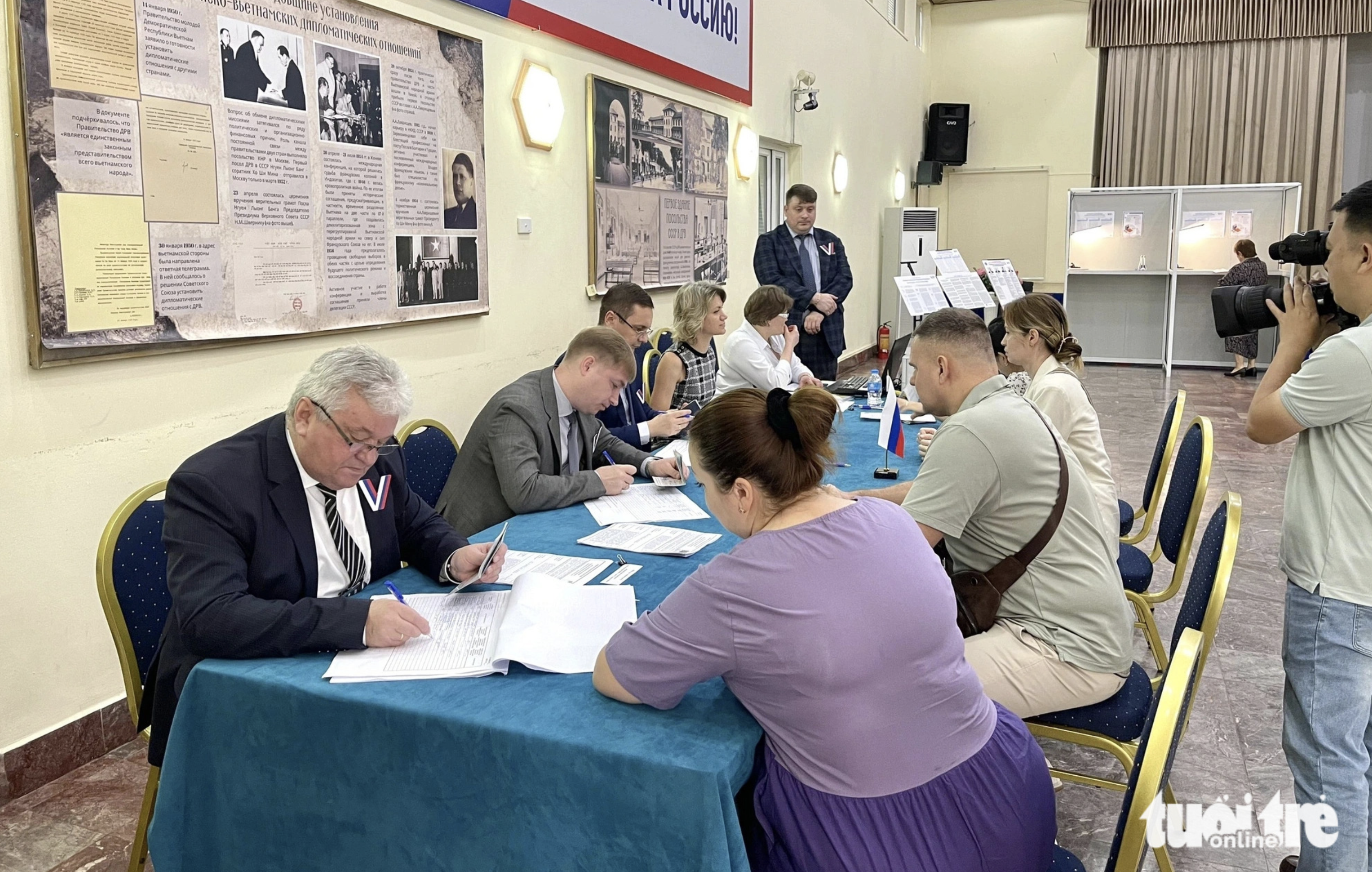 Russian voters check their personal information before casting their ballots. Photo: Thanh Hien / Tuoi Tre