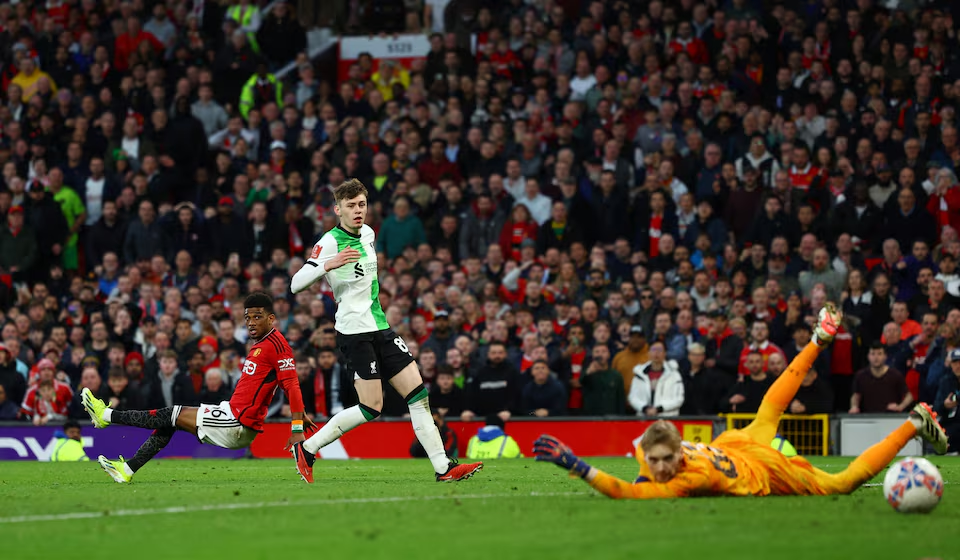 Soccer Football - FA Cup - Quarter Final - Manchester United v Liverpool - Old Trafford, Manchester, Britain - March 17, 2024 Manchester United's Amad Diallo scores their fourth goal past Liverpool's Caoimhin Kelleher. Photo: Reuters